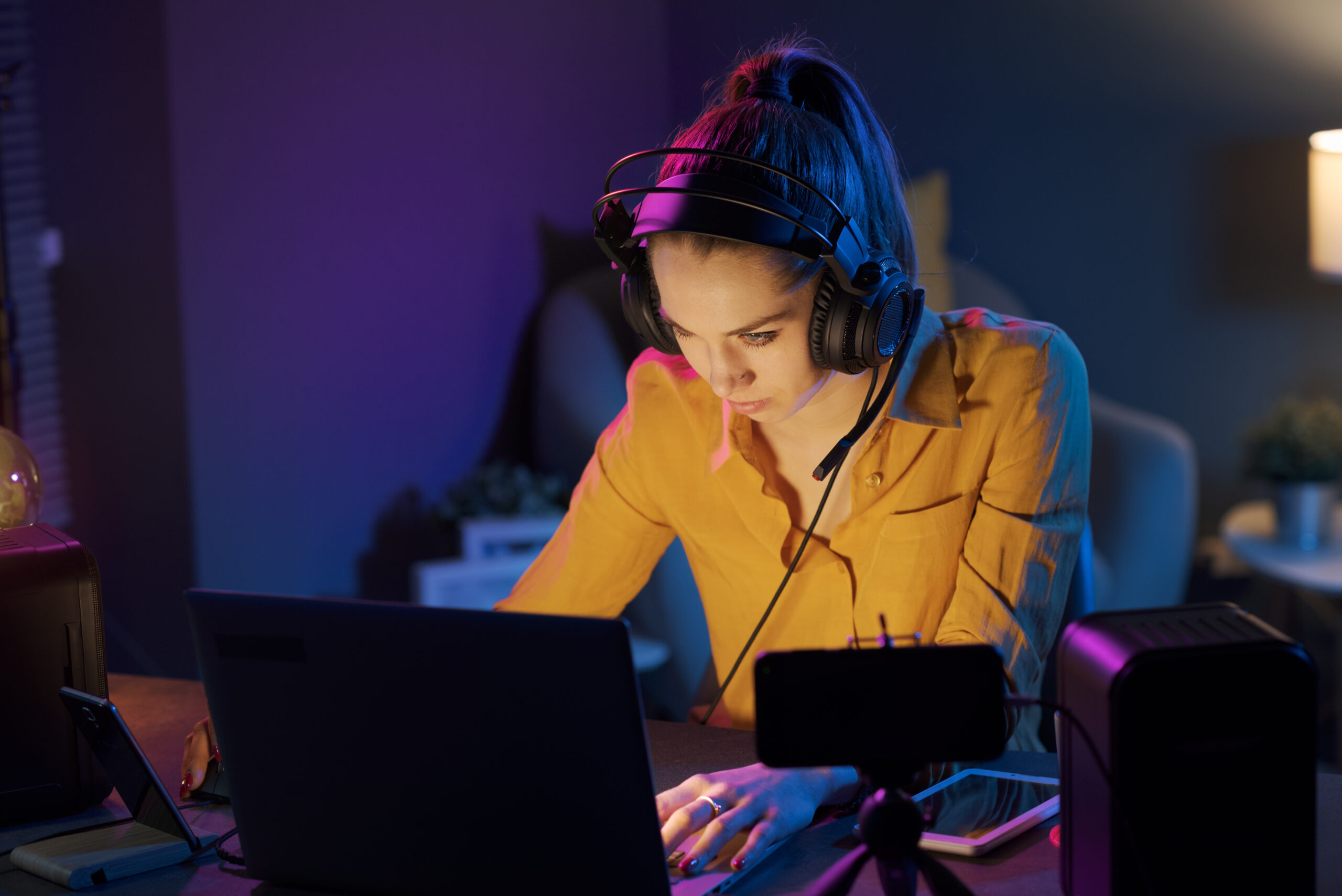 Young gamer playing online late at night